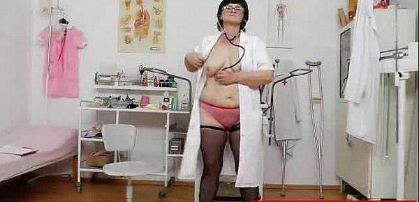  Brunette medic examining her pussy